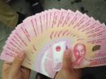 100 Đồng kỉ niệm 65 năm